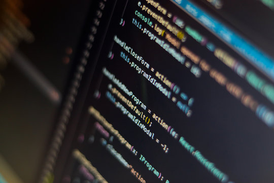 Program code visualization on computer display close-up