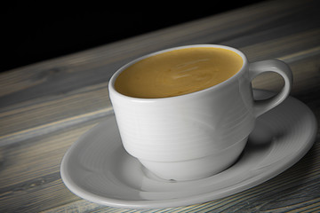 aromatic black coffee in a white cup on a dark background.