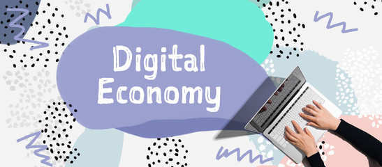 Digital economy concept with person using a laptop computer