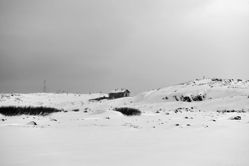 old houses under snow in the Russian Arctic