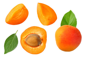 apricot fruits with slices and green leaf isolated on white background. top view
