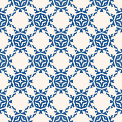 Vector ornamental seamless pattern. Floral geometric background, repeat tiles, diamonds, stars, flower grid, lattice. Abstract indigo blue and white ornament texture. Elegant oriental style design