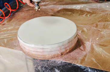 Making upholstered furniture, preparing a seat for a bar stool, applying glue with a spray gun