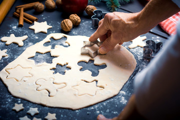 Man making a festive decorated pastry with a mold