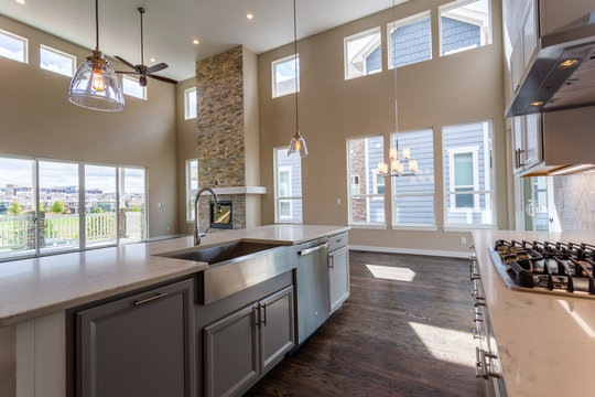 Great Room With Clerestory, High Ceiling, Window-wall, And Sliding Glass Doors In An Open Floorplan Home