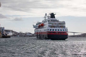 Fototapeta na wymiar Coastal ships departure from Bronnoysund harbor, Northern Norway