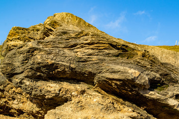 cobblestone on a mountain fenced by a wooden fence, selective focus