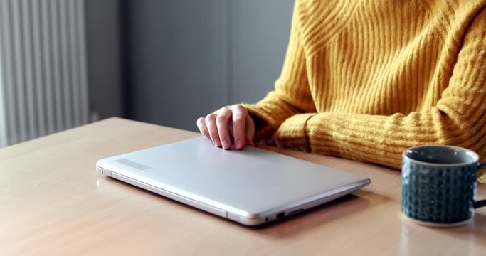 Woman Concerned About Excessive Use Of Internet Closing Lid Of Laptop Computer