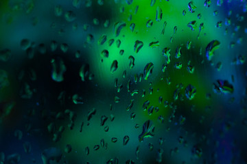 Raindrops on a window with bokeh