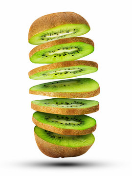 Fresh sliced kiwi fruit flying in the air isolated on white.