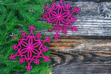 Christmas decoration with fir branches on the background of a tree with copy space