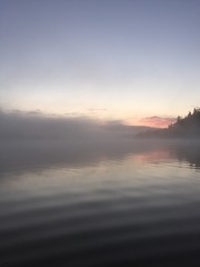 sunset over sea with fog 
