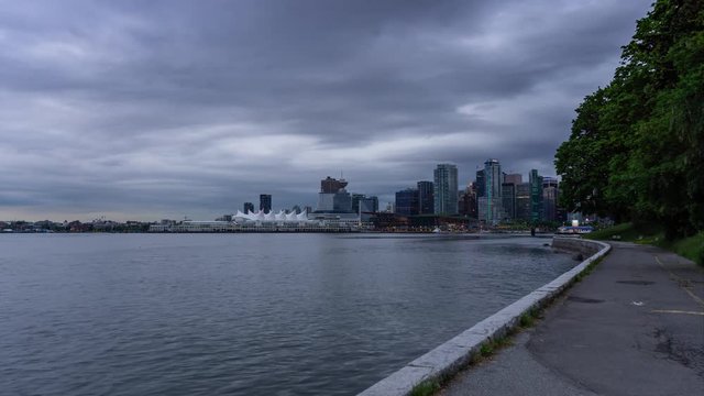 Time Lapse of Beautiful view of Vancouver Downtown during a morning sunrise. Picture taken from Stanley Park in British Columbia, Canada.