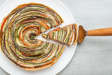 classic ratatouille pie on a light gray table.