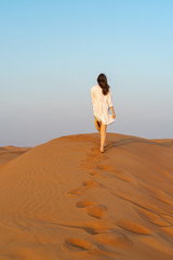 Fototapeta na wymiar young woman in the desert