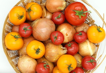 tomatoes and onions in a basket