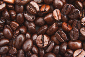 Roasted coffee beans texture used as a background / Close up