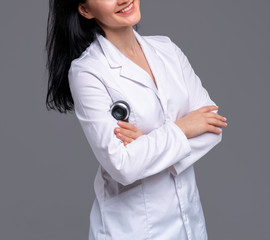 Smiling female beautician with dermatoscope in hands.