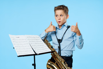 young boy with saxophone