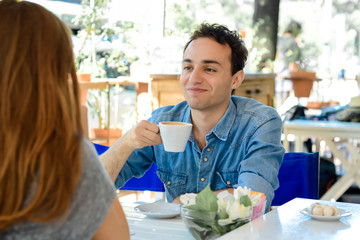 Couple enjoying a coffee at the coffee shop
