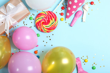 Flatlay composition with accessories for a party or birthday on a colored background with place for text top view.