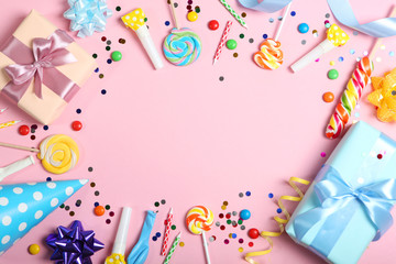Flatlay composition with accessories for a party or birthday on a colored background with place for...