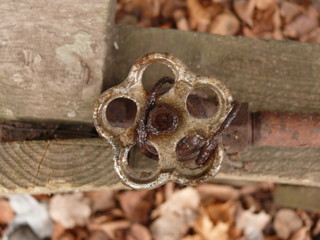 Detail of a rusted water tap.