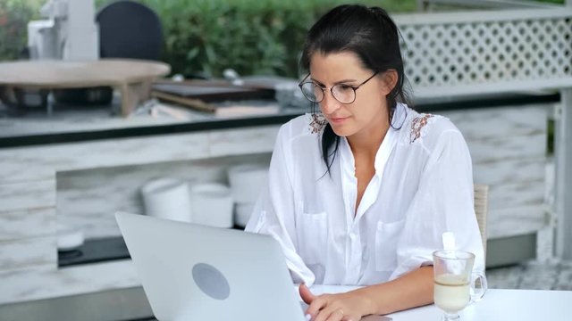 Young attractive casual lady enthusiastically watching using digital display technology