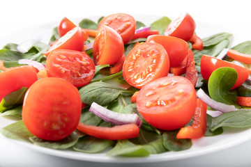 Fresh salad with tomatoes, isolated on white background