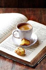 Cup of coffee with cantuccini  (Italian cookies) on rustic wooden background. 