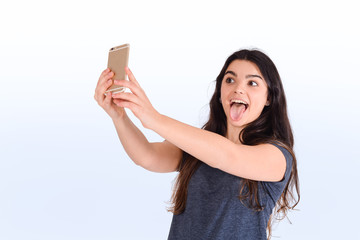 Naklejka premium Young woman taking selfie