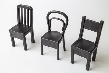 Obraz premium Close up of vintage chairs composition isolated on white.