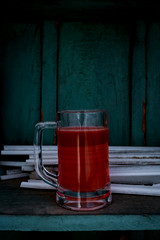 glass of beer on wooden table