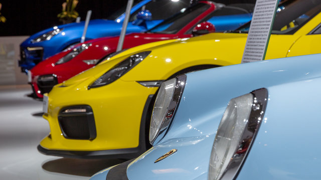 AMSTERDAM - APRIL 16, 2015: Row Of Various Porsche Sports Cars Showcased At The AutoRAI Motor Show.