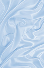 Smooth elegant blue silk or satin luxury cloth texture as abstract background. Luxurious background design