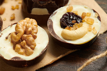Homemade chocolate candies on rustic table, sweet food, macro photo