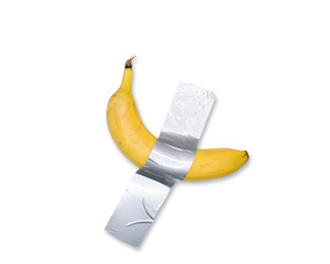 A banana taped to the wall.Popular photo.Trend.