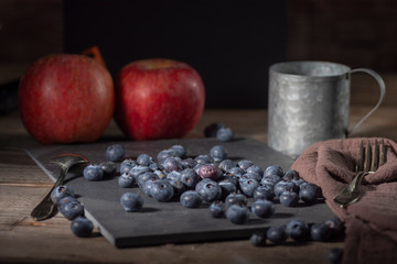 Blueberries on rustic table for healthy eating and nutrition
