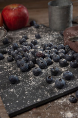 Blueberries on rustic table for healthy eating and nutrition