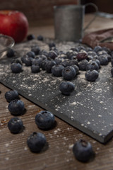 Blueberries on rustic table for healthy eating and nutrition