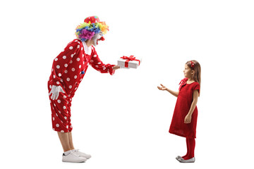 Clown giving a present to a girl