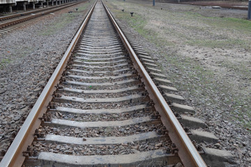 Fototapeta na wymiar Sleepers and rails - the outgoing railway.