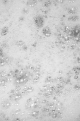 Foam bubble from soap or shampoo washing on top view. Foam background. White foam.