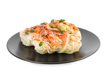 Plate with delicious cabbage rolls isolated on white