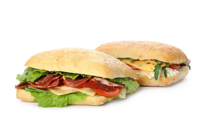 Delicious sandwiches with fresh vegetables isolated on white