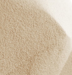 Golden Sand on the beach as background. Sand Texture. Golden sand. Background from fine sand.