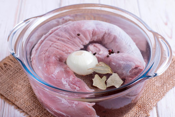 Meat in a pan with onions and spices, cooking broth