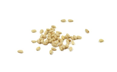 peeled pine nuts isolated on a white background 