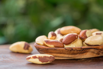 Bertholletia.Brazil nuts on wooden texture
