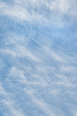 Obraz premium Background with clouds of uncertain shape in light blue sky_